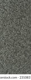 close up, background, texture, large long vertical banner. surface structure black expanded polyethylene, EPE, padding cushioning material for packages. full depth of field. high resolution photo