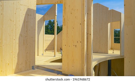 CLOSE UP: Beautiful Hardwood Real Estate Project Is Erected In The Countryside. Glued-laminated Timber House Is Being Built In Countryside. Aluminum Ladders Lie Around The CLT House Under Construction