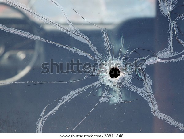 CLOSE -UP OF BROKEN CAR
WINDOW
