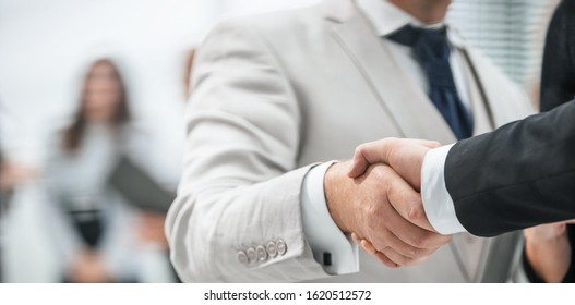 close up. business handshake on office background. - Shutterstock ID 1620512572