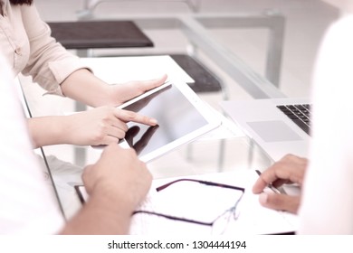 close up.the business team uses a digital tablet to work in the office - Shutterstock ID 1304444194