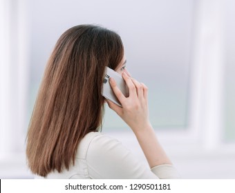 close up. business woman talking on a mobile phone