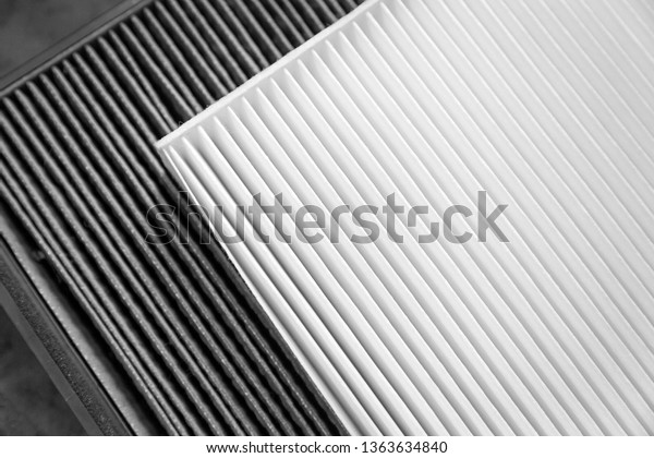Close up, clean and dirty cabin\
air filter for car. car air filter texture and\
background