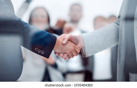 Close Up. Confident Business Handshake On An Office Background.