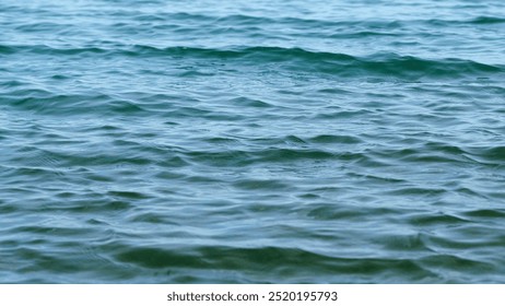 Close up. Continuously Changing Turquoise Sea Or Ocean Surface Water. Water Moving On Ocean Surface.