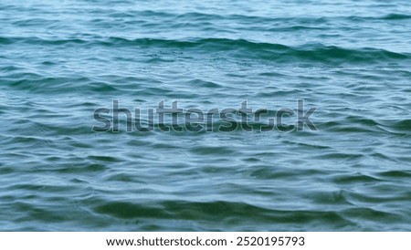 Close up. Continuously Changing Turquoise Sea Or Ocean Surface Water. Water Moving On Ocean Surface.