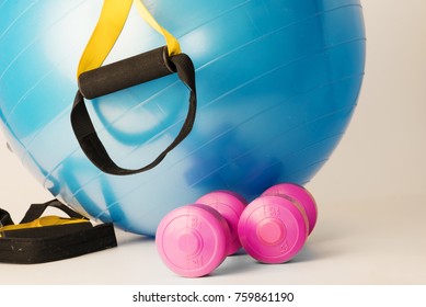 Close Up, Different Types Of Gym Weights With Trx Ropes On White Background