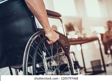 Close up. Disabled Man on Wheelchair in Office. Disabled Young Man. Man on Wheelchair. Recovery and Healthcare Concepts. Teamwork in Office. Young Workers. Sitting Man. Happy Worker. - Powered by Shutterstock