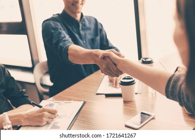 close up. financial partners shaking hands over the Desk. - Shutterstock ID 1721641267