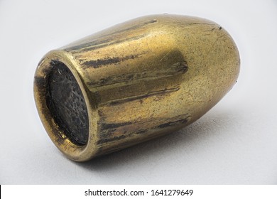 Close Up, Forensics Ballistics Rifling Marks On Bullet Also Known As Land Impressions And Groove Impressions, White Background. High Resolution 