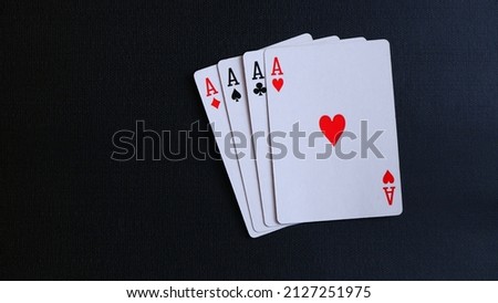 Close up, Four aces on black background. Space for text. Copy space. Casino and Poker Concept.