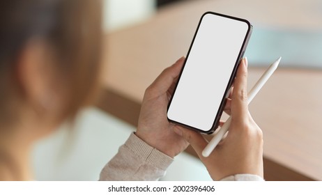 Close up, a girl using smartphone with holding stylus pen  - Powered by Shutterstock