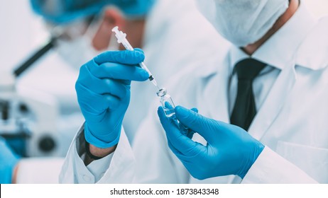 close up. group of scientists conducting trials of the new vaccine .