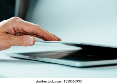 Close Up. Image Of A Man Opening The Cover Of His Laptop.