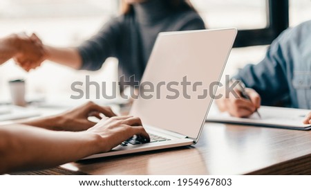 close up. image of a man working on an office laptop .