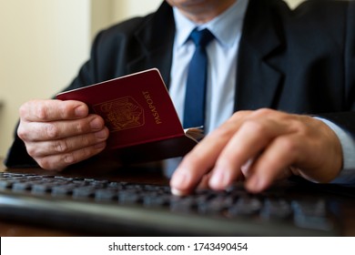 Close Up. The Immigration Control Officer Verifies Passport Identification Data.
