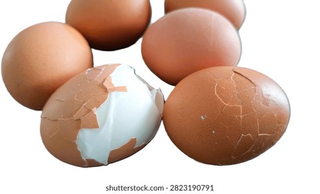 Close up, isolated example of Hardboiled eggs on a surface with the shells rolled and cracked for easy peeling. Close-up of multiple hard-boiled eggs showing the rolling method to crack shells before peeling. Hard-boiled eggs on an isolated background, rolled on a hard surface to crack the shell for easy peeling. Photo of Cooled and gently tapped hardboiled eggs showing the roll and crack technique against a clean background.