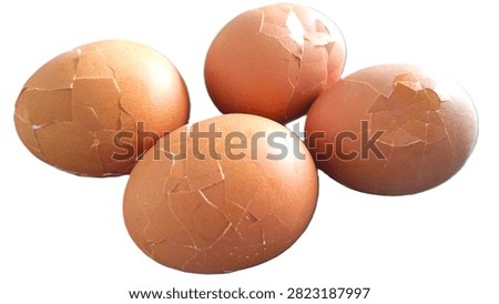 Close up, isolated example of Hardboiled eggs on a surface with the shells rolled and cracked for easy peeling. Close-up of multiple hard-boiled eggs showing the rolling method to crack shells before peeling. Hard-boiled eggs on an isolated background, rolled on a hard surface to crack the shell for easy peeling. Photo of Cooled and gently tapped hardboiled eggs showing the roll and crack technique against a clean background.