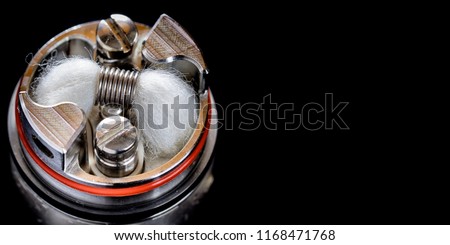 close up, macro shot of single micro coil with japanese organic cotton wick in high end rebuildable dripping tank atomizer for flavour chaser, vaping device, vape gear, vaporizer equipment