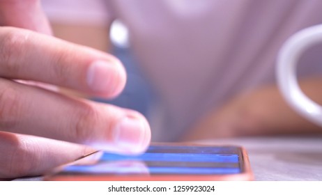 Close Up, Male Finger On Touchscreen Smartphone. Man Uses Mobile Phone