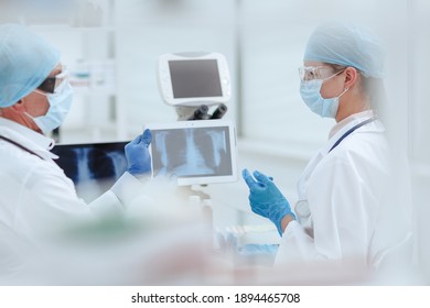 close up. medical colleagues discussing the x-ray. - Powered by Shutterstock