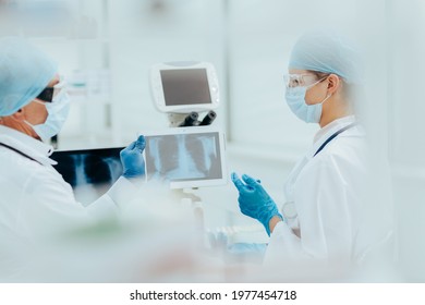 close up. medical colleagues discussing the x-ray. - Powered by Shutterstock