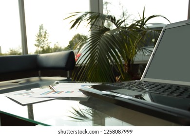 Close Up. Open Laptop On The Table In The Lobby Of A Modern Bank