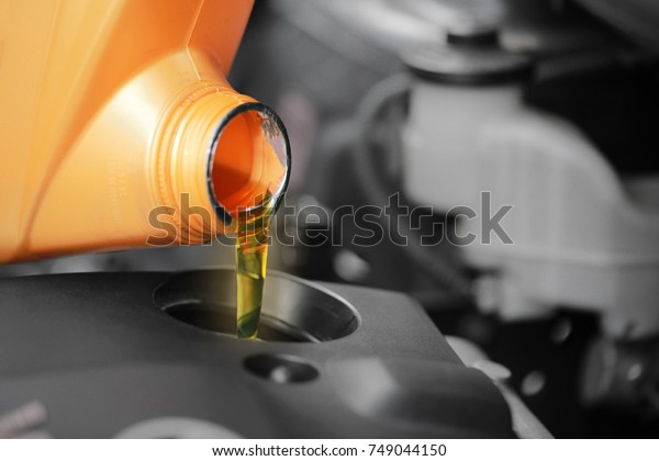 Close up, Pouring\
motor oil to car engine.