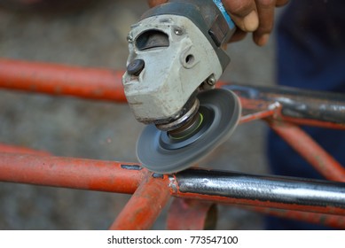 Close Up, Removing Rust And Old Paint From Metal With Angle Grinder