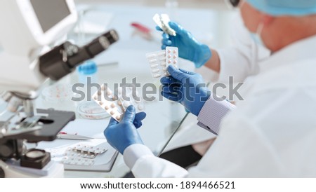 close up. scientists are testing samples of new drugs .