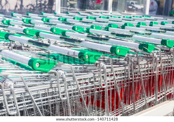 Close up, shopping carts outside of\
supermarket in rows./shopping\
carts/shopping