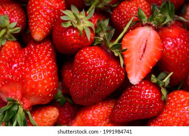 Close up, texture and background of red ripe, freshly harvested strawberries in summer - Powered by Shutterstock