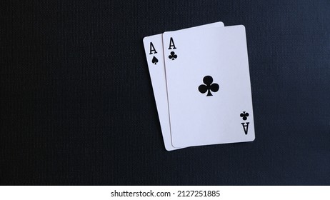 Close up, two aces on a black background. Poker and casino concept. Playing card isolated on a black background.