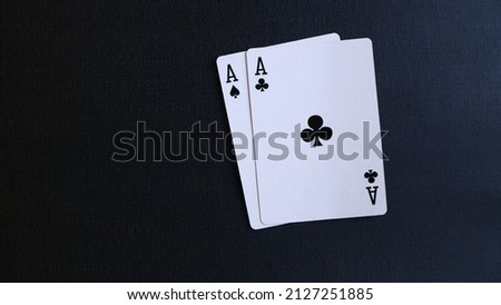 Close up, two aces on a black background. Poker and casino concept. Playing card isolated on a black background.
