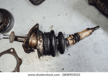 Close up: worn spherical joints and rubber dampers of the gear shift mechanism. Replacement of the linkage and bushings to eliminate play in the manual transmission.