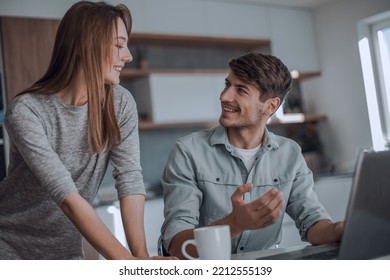 Close Up. Young Couple Looking At Laptop Screen