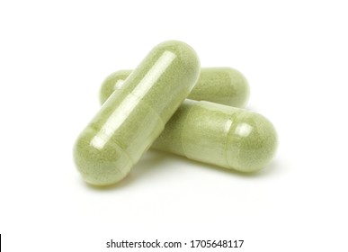 Close up,Andrographis Paniculata capsules or herbal capsules isolated on a white background.