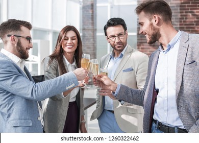 close up.business team raises their glasses. - Powered by Shutterstock