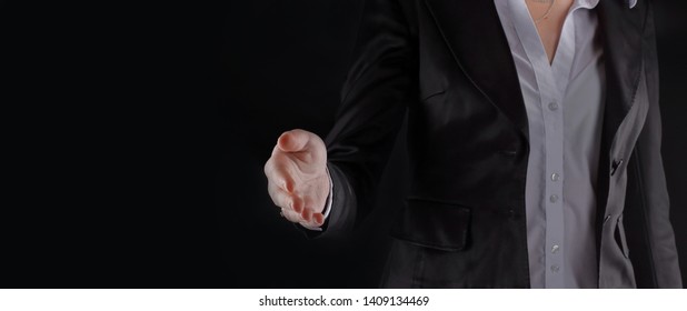 Close Up.business Woman Stretches Out Her Hand For Handshake.isolated On Black Background