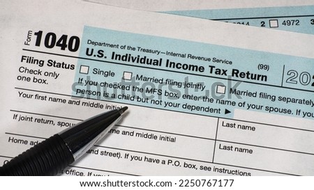 A close up of upper left corner of IRS form 1040 with focus on filing status options.