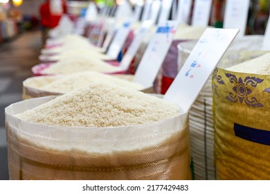 Close Up,Piles Of Thai Aromatic Rice,White Rice In The Sacks,Raw Grain,Khao Hom Mali Jasmine Husked In The Market,grocery Store,Milled Or Parboiled Rice,dry Food,diet,nutrition,healthy Food Concept