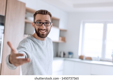 close up.young man standing in the kitchen