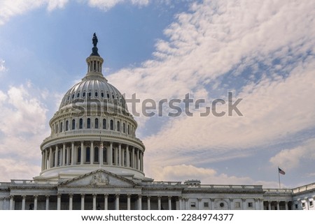 Close up of US Capitol Building dome with cloud sky 