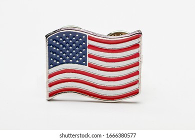 Close Up Of A USA Flag Pin Isolated Against A White Background