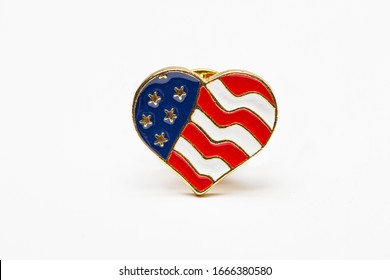 Close Up Of A USA Heart Flag Pin Isolated Against A White Background
