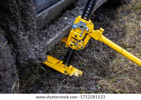 Close up of using a high-lift jack.