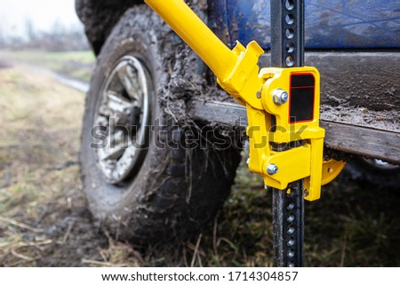 Close up of using a high-lift jack.