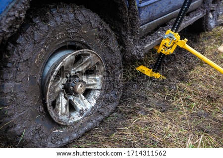Close up of using a high-lift jack.