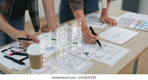 Close up ux developer and ui designer brainstorming interface wireframe design.Creative digital development agency