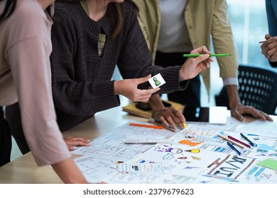 Close up ux developer and ui designer use augmented reality brainstorming about mobile app interface wireframe design on desk at modern office. creative digital development agency